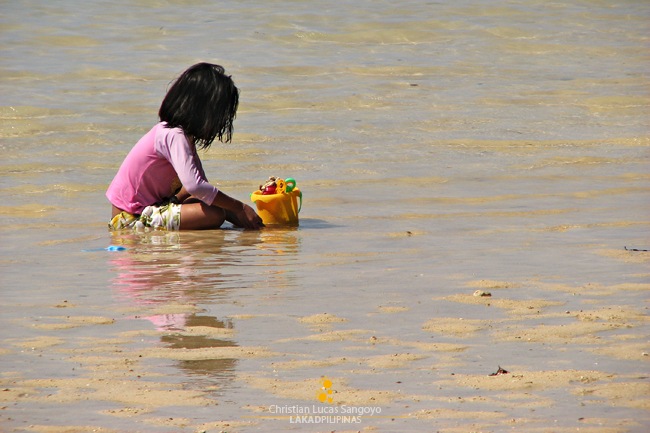 Kids Busy on the Sand at Sab-Itan Laya Island in Caramoan