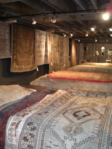 Their rug room is heaped with incredibly beautiful tapestries.