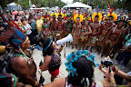 Sonia Bone Guajajara, VP of  the Coordination of the Indigenous Organizations of the Brazilian Amazon (COAIB), addresses indigenous marchers on Rio's Flamengo Beach on June 19, 2012. ©Caroline Bennett