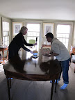Hey, what's going on?  Why are Martha and Gyurme moving things off the table?