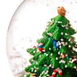 Close up of a small Christmas tree inside a spherical glass --- Image by © Royalty-Free/Corbis