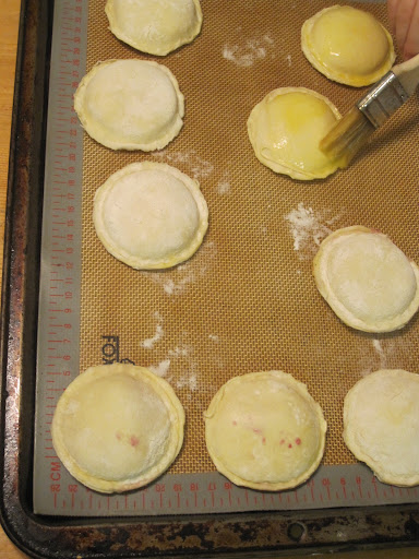 Brushing with egg wash. Brushing with egg wash.