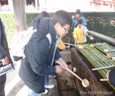 Sang taking holy water in Todaiji Temple, Nara