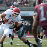 South Dakota's Tyler Wilhelm is tackled by UM's Josh Stuberg.  Washington - Grizzly Stadium, Montana Grizzlies vs. South Dakota Coyotes.  Missoula, MT, September 1st, 2012.
