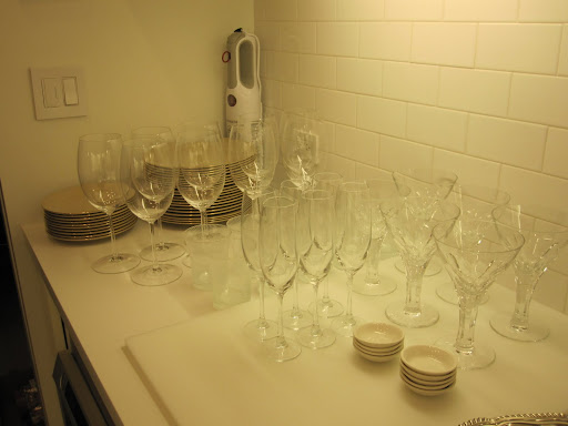 Different size plates have also been set out and are ready to be placed on the dining room table.