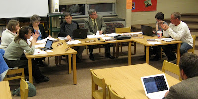 Washington School Board members sat on small chairs in Stewart Elementary's Media Center for their meeting Wednesday