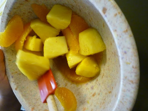 Monty whisks the dressing in with her fruit.