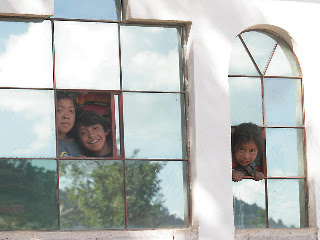 Children in the next village. Jason and I had gone on a walk and were lost in the maze of the village trying to find our way out to the road, feeling somewhere between intrusive and nervous,when all these kids appeared in a window. Photos by TOM HART