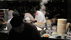 It took a lot of chefs to keep up with all the steaming baskets and frying pans.