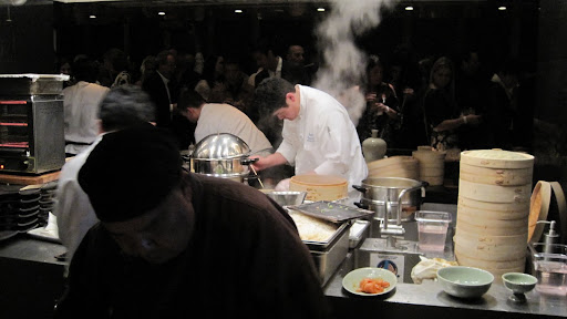 It took a lot of chefs to keep up with all the steaming baskets and frying pans.