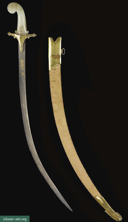 A MUGHAL JADE-HILTED SWORD WITH GILT-MOUNTED SCABBARD, INDIA A MUGHAL JADE-HILTED SWORD WITH GILT-MOUNTED SCABBARD, INDIA