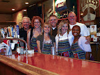 The Progressive Dinner Party Long Beach team poses behind the bar at Curley's Cafe with the owner Sean Hitchcock (right) and Earl Kelly (left), the spouse of PDPLB member Kristine Kelly. The PDPLB members are, Josi Jenneskens and her husband Spencer Langdon, Nancy Valencia, Kristine Kelly and Adreana Langston. The Progressive Dinner Party Long Beach team poses behind the bar at Curley's Cafe with the owner Sean Hitchcock (right) and Earl Kelly (left), the spouse of PDPLB member Kristine Kelly. The PDPLB members are, Josi Jenneskens and her husband Spencer Langdon, Nancy Valencia, Kristine Kelly and Adreana Langston.