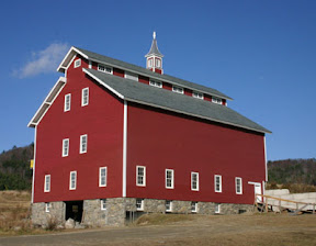Restored west monitor with local clapboards and slate roofing.