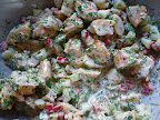 Shrimp cut into bite-size pieces and tossed with mayo, bell pepper, cukes, cilantro, and mint.