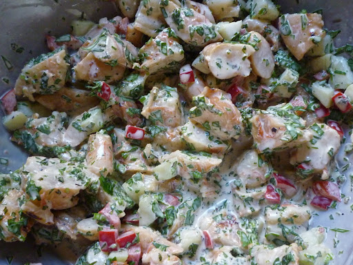 Shrimp cut into bite-size pieces and tossed with mayo, bell pepper, cukes, cilantro, and mint.
