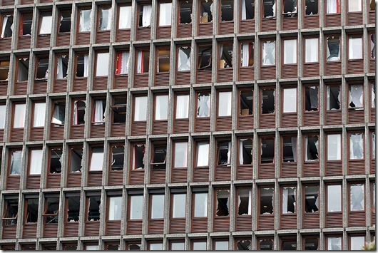Shattered windows of a major building after an explosion in Oslo, Norway, Friday July 22, 2011. A loud explosion shattered windows Friday at the government headquarters in Oslo which includes the prime minister's office, injuring several people.  Prime Minister Jens Stoltenberg is safe, government spokeswoman Camilla Ryste told The Associated Press. (AP PHOTO / Berit Roald, Scanpix) NORWAY OUT