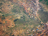 The edge of the capital city, Tana, as seen from the plane. Though you can see it's heavily populated, you can also see that it's still heavily agricultural and not much developed by first world standards. IMG_1395.jpg
