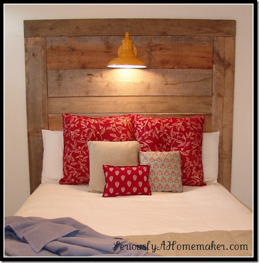 barn wood headboard with yellow lamp