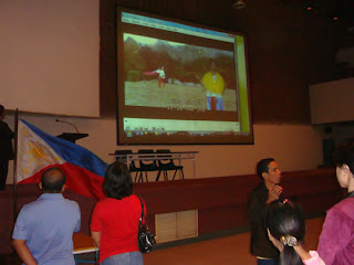 MCCID National Anthem Sign Language video shown on stage.