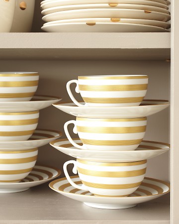 Here is Martha's clever way for storing teacups and saucers. Place cup over saucer, in tidy stacks of no more than three or four that suit them to a T (or a teacup).
