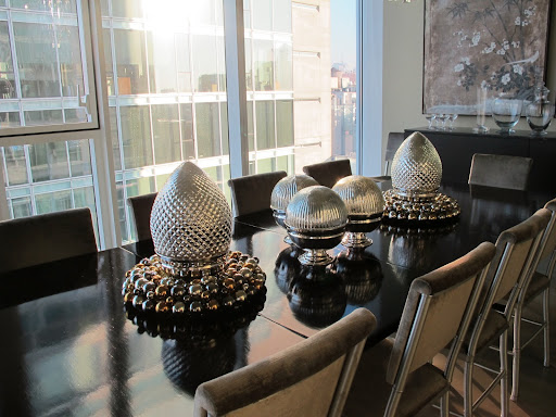 This year, I've created a centerpiece with oversized kugels and ornament wreaths for my dining table.