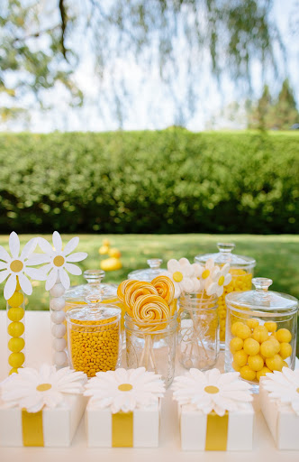 Candy buffet with daisy favor boxes. 

Photograph by Allan Zepeda (allanzepeda.com) for Elan Artists (elanartists.com)