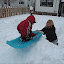 Sledding in the backyard Olympic pavilion. &ndash; 28-Feb-2010