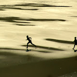 Kids running on the beach