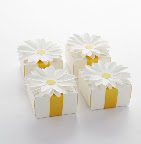 A daisy gift box will give your guests a memorable favor to bring home from the party. Fill with yellow candy, a thank-you note, or a special keepsake.
The daisies on top are easy to assemble, each kit provides 16 daisies along with yellow and green stickers for the centers.
