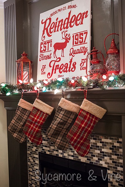 Plaid Country inpired Christmas Fireplace. A truly stunning Christmas Home Tour as part of the Christmas in the Country Blog Tour. This Plaid Inspired Country Christmas will knock your socks off. Features tours of the Living room, Dining Room and a Cocoa hot chocolate bar in the Breakfast room. There is so much inspiration for Christmas decorations in this one post. Be prepared to feel like you are cuddled up by the fire in a warm Northwoods comfy cottage! #country #Christmas #Plaid #Holiday decorating #Holiday ideas #Holidays #Christmas decor #Holiday decor Plaid Country inpired Christmas Fireplace. A truly stunning Christmas Home Tour as part of the Christmas in the Country Blog Tour. This Plaid Inspired Country Christmas will knock your socks off. Features tours of the Living room, Dining Room and a Cocoa hot chocolate bar in the Breakfast room. There is so much inspiration for Christmas decorations in this one post. Be prepared to feel like you are cuddled up by the fire in a warm Northwoods comfy cottage! #country #Christmas #Plaid #Holiday decorating #Holiday ideas #Holidays #Christmas decor #Holiday decor