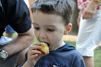 Oli tucking into a cupcake