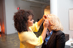 Here, Rosie applying false eyelashes.