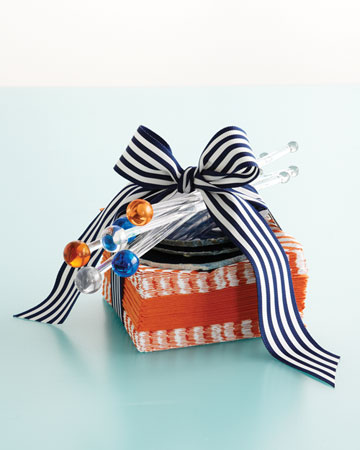 For a dinner party, I love to pare the extraavagant weekend gift to a few beautiful pieces: a big stack of napkins, coasters, and festive swizzle sticks.