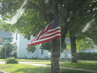 Flag along Washington Street, placed by the Optimist Club of Washington.