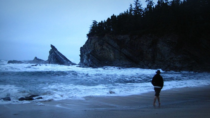 Taylor walking along Simpson Beach at Shore Acres State Park Coos Bay Oregon