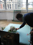 Matthew Robbins, on set, tweaking the bouquet for the shot.