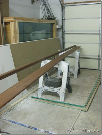 staining stair hand rail.