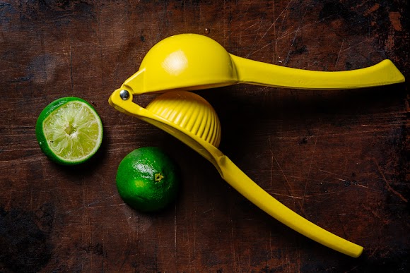 Lime halves and a yellow squeezer lime halves.jpg