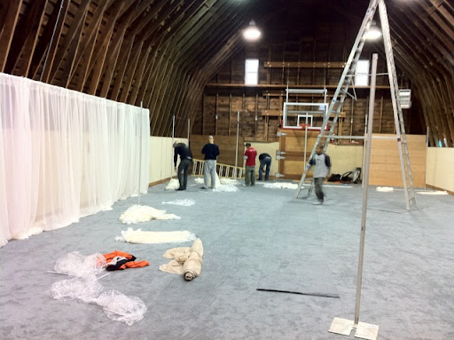 The walls were draped with hundreds of yards of ivory voile.