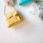 Clutches are great for your bridesmaids, but you might want a purse with a handle. This bag is spacious enough to carry your lipstick and a few emergency items.