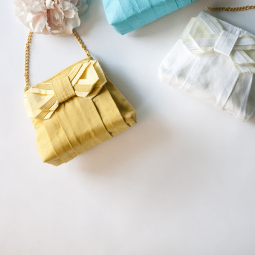 Clutches are great for your bridesmaids, but you might want a purse with a handle. This bag is spacious enough to carry your lipstick and a few emergency items.