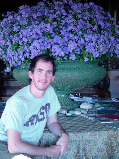 Me in front of an outdoor garden urn that I filled with ageratum, which Martha brought inside.
