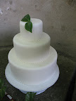 We propped it up on a cake stand, and then added flowers and foliage for a bit of color.
