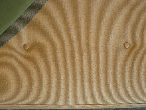 The ribs on the fabric on my living room sofa disguise a lot. But if you look at it from the certain angle, you can see all of the marks.