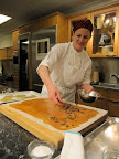The warm toffee is then sprinkled with chocolate, which melts on top of the toffee. The warm toffee is then sprinkled with chocolate, which melts on top of the toffee.