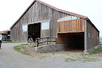 Their amazing barn. Can't you just picture huge drapes of fabric hung up over the entrance? Their amazing barn. Can't you just picture huge drapes of fabric hung up over the entrance?