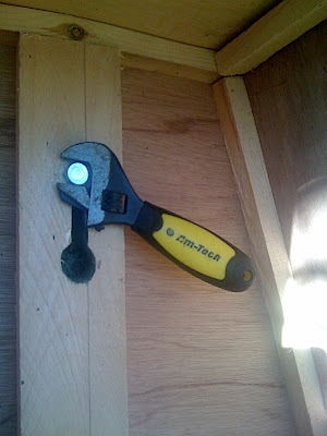 The bolts are tightened with a wrench, once the box is dropped on through the hole.