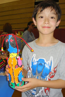 Kai showing off his creation at the Haverford art show for all the district's elementary schools
