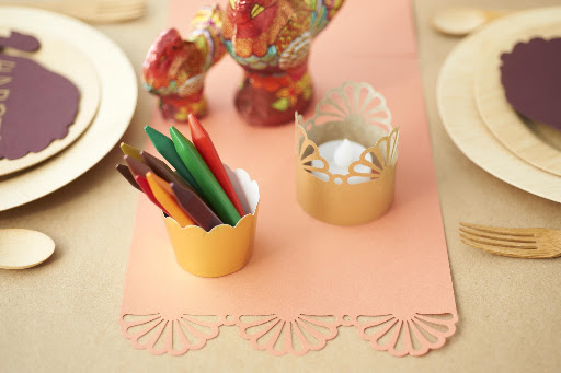 I used orange paper with a punched edge as a festive and easy runner the kids could also decorate. (Fine paper from Paper Source, and Melissa and Doug coloring crayons, www.melissaanddoug.com)