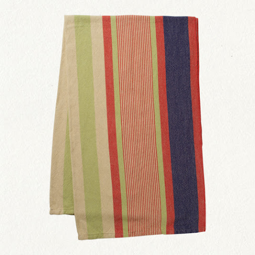 Using a pretty blanket underneath towels gives you more beach space. (shopterrain.com)